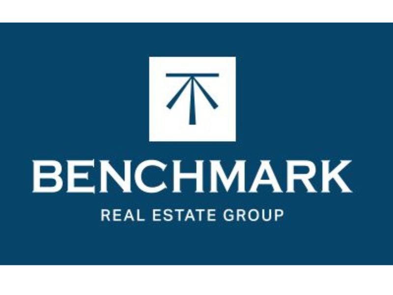 Benchmark Real Estate white blue logo